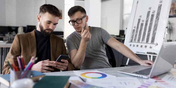 men-analyzing-graph-together-work men-analyzing-graph-together-work