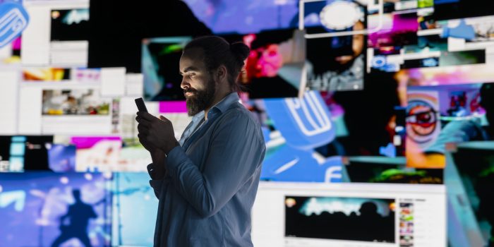 Smartphone user addicted by social media content consumption Smartphone user addicted by social media content consumption and obsessive doomscrolling that can trigger anxiety and harmful self esteem issues in the digital world. Overuse isolation.